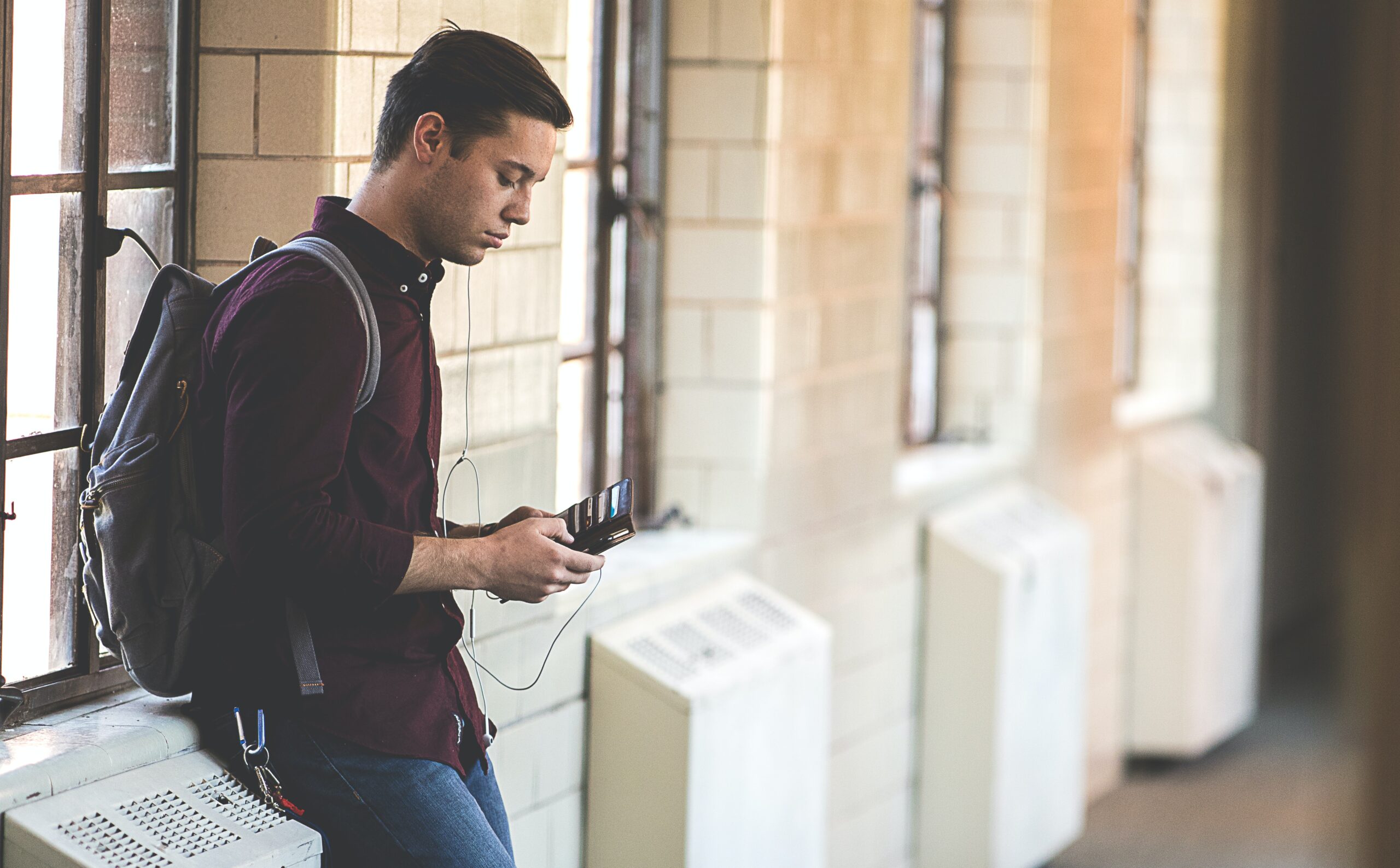 Student looks at phone