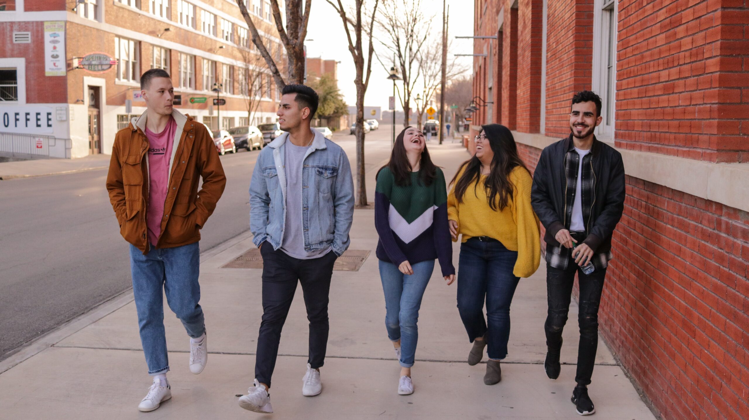 Students walk down sidewalk