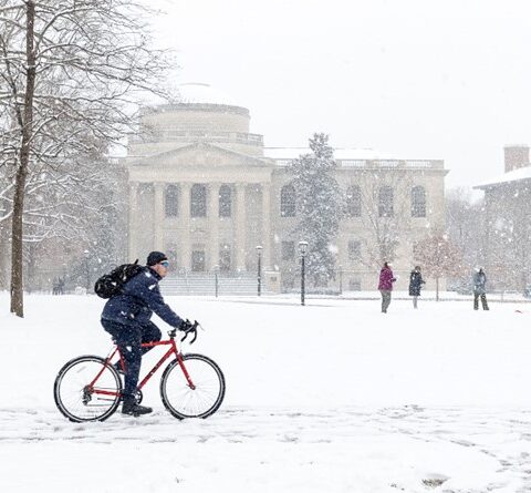 Student bikes across the quad