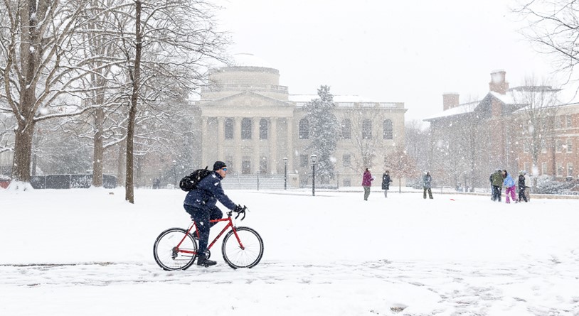 Student bikes across the quad